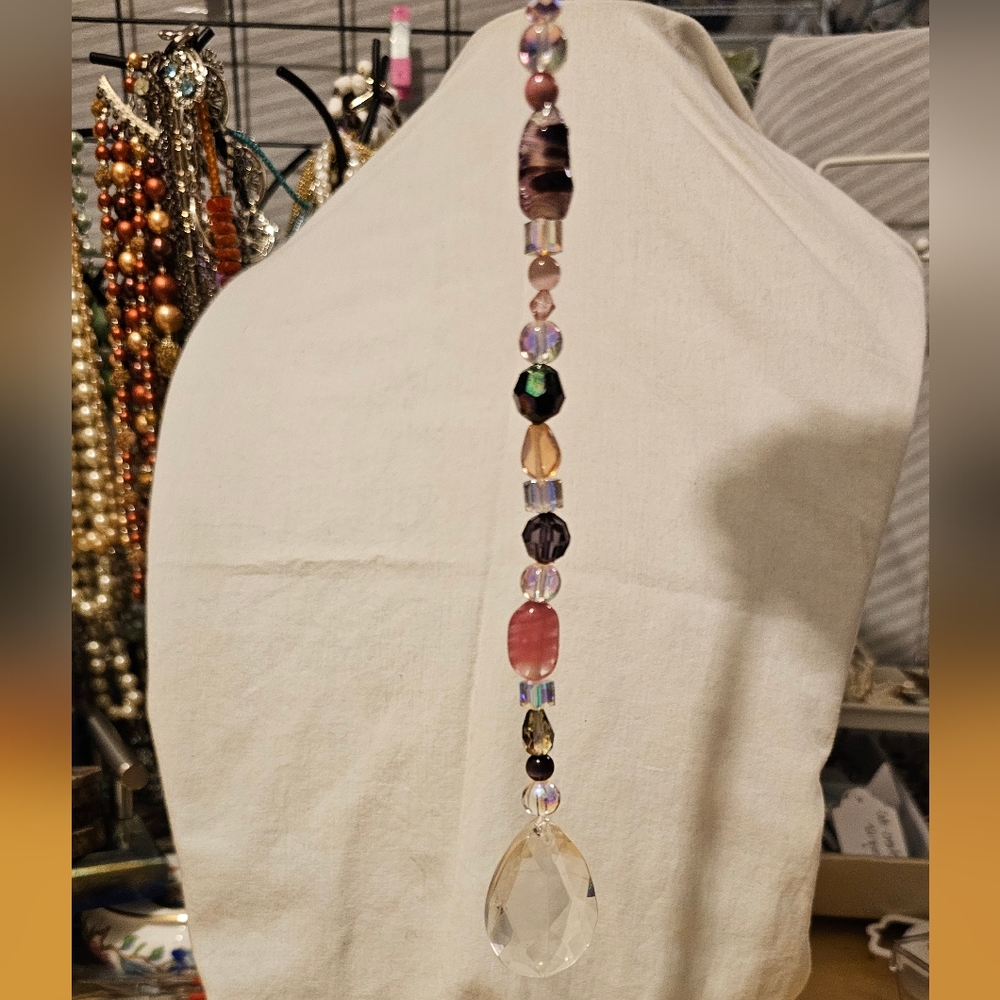 Suncatcher, mixed media and upcycled, in pinks and purple tones